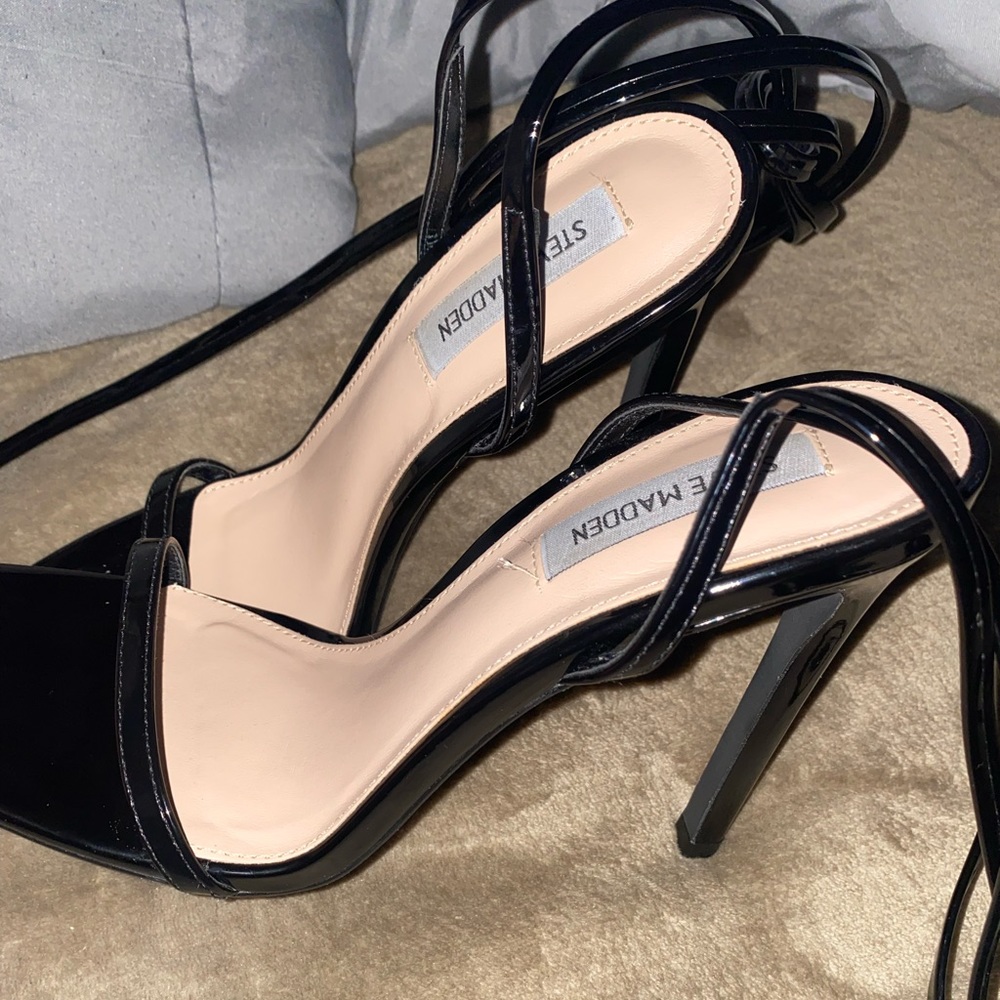 Black strapped up heels, can go up your leg if you choose.